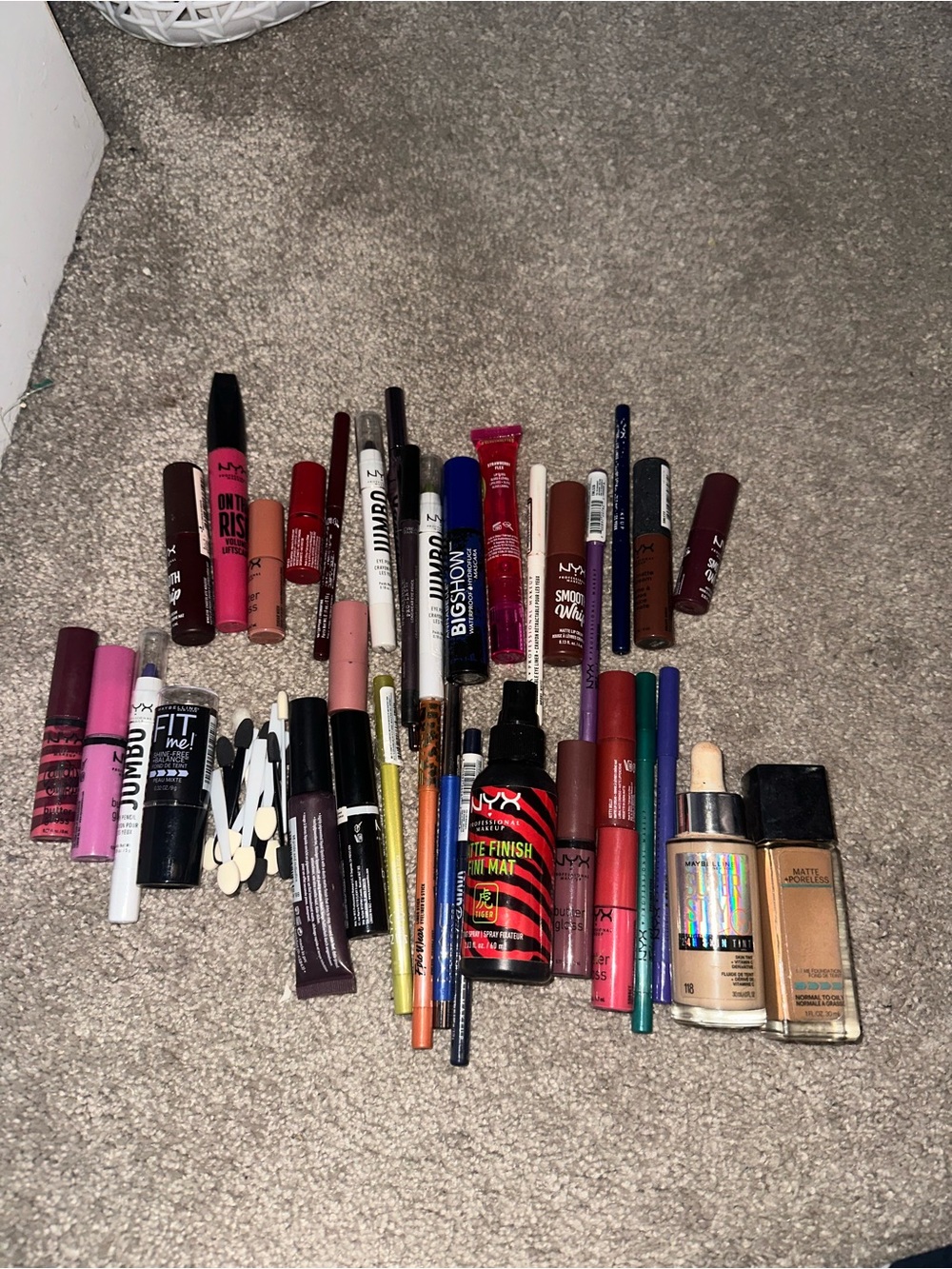 A bunch of makeup (sealed and some opened to try or used slightly)